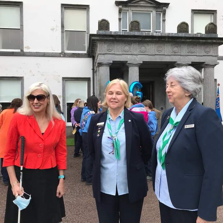 Three woman, including Irish Girl Guides Ambassador Sinead Kane, stood talking
